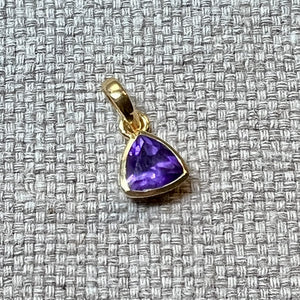 Pendant with a triangular blue topaz gemstone
